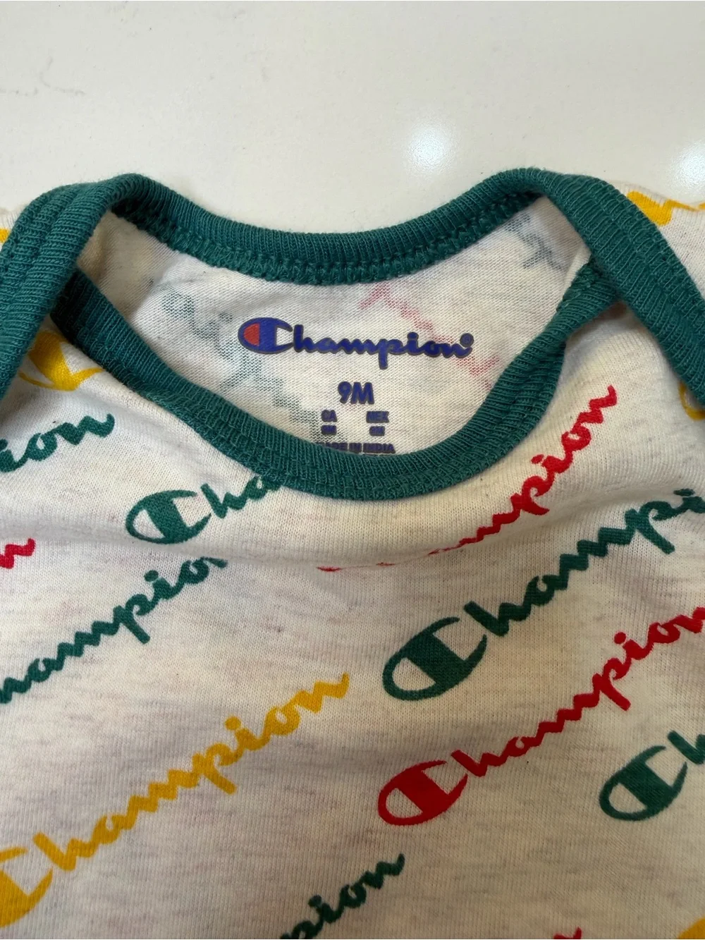 Champion 4-piece baby bodysuit bundle in size 6-9 months/9 months
